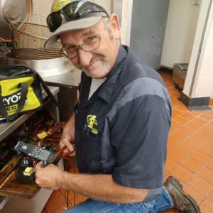 Tommy troubleshooting a fryer.