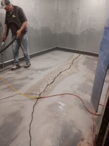 Repairing a bowed concrete floor.
