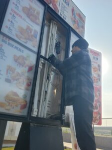 Working on a menu board.